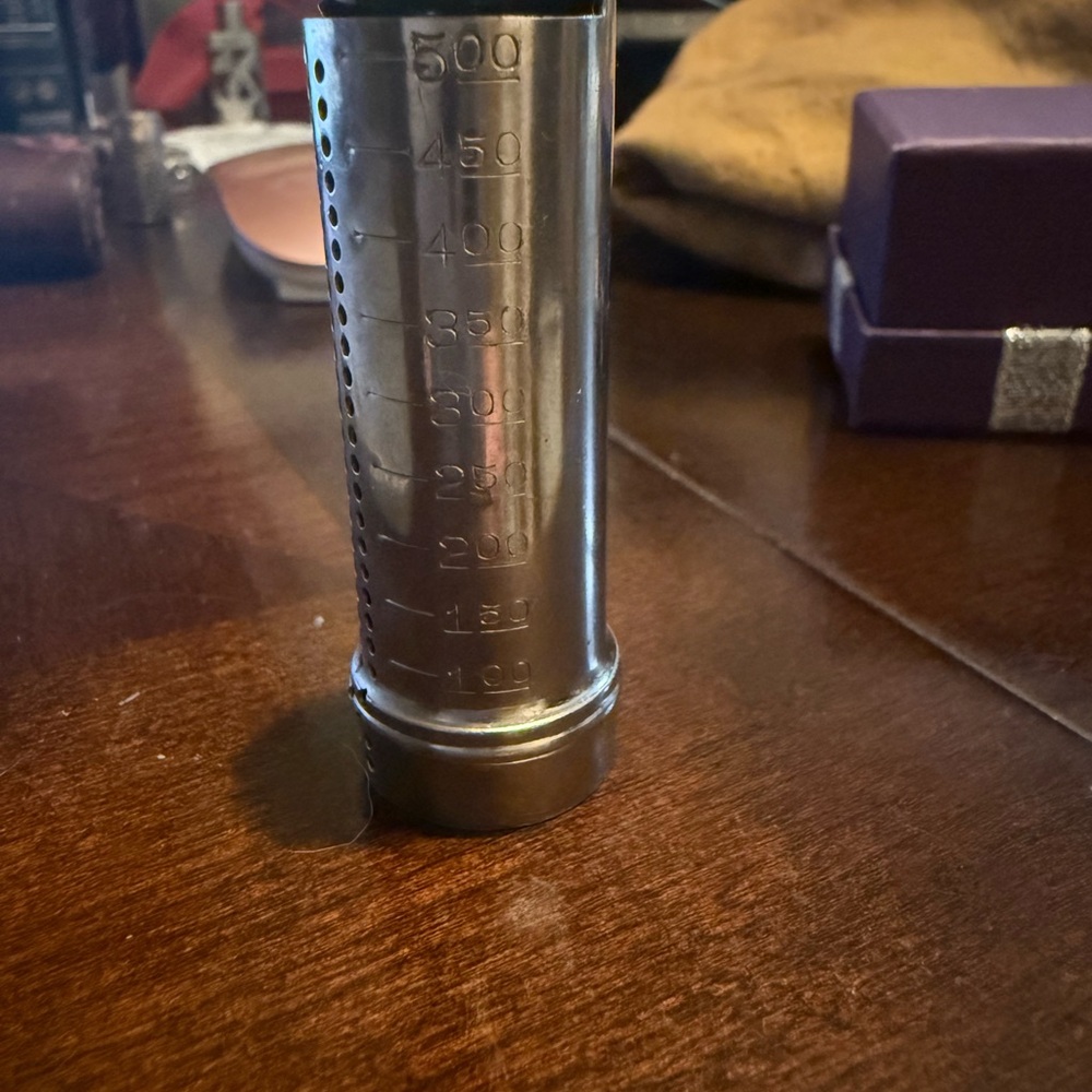 Sleek Silver Cylindrical Storage Container with Stability